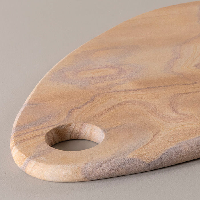 Elegant natural stone cutting and serving board, featuring unique grain patterns and a modern, sophisticated design.